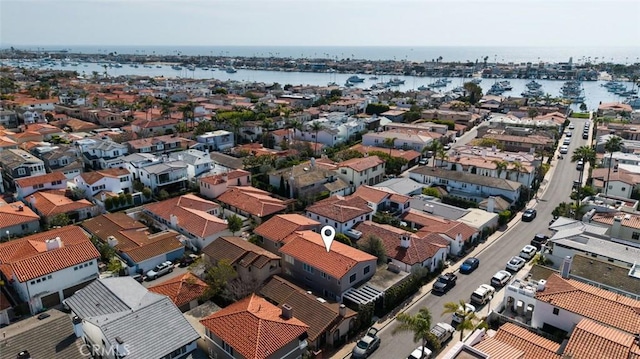 bird's eye view featuring a residential view and a water view