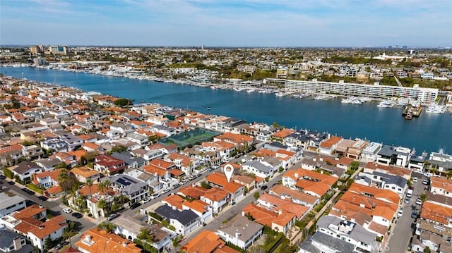 drone / aerial view with a water view and a residential view