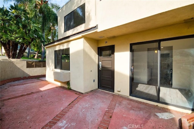 property entrance with a patio