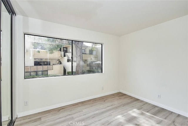 unfurnished room featuring light hardwood / wood-style flooring