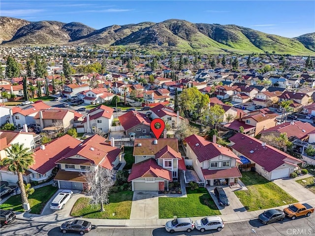 drone / aerial view with a residential view and a mountain view