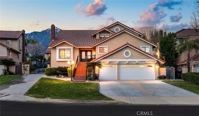 view of front facade with a tiled roof, stairway, concrete driveway, and stucco siding