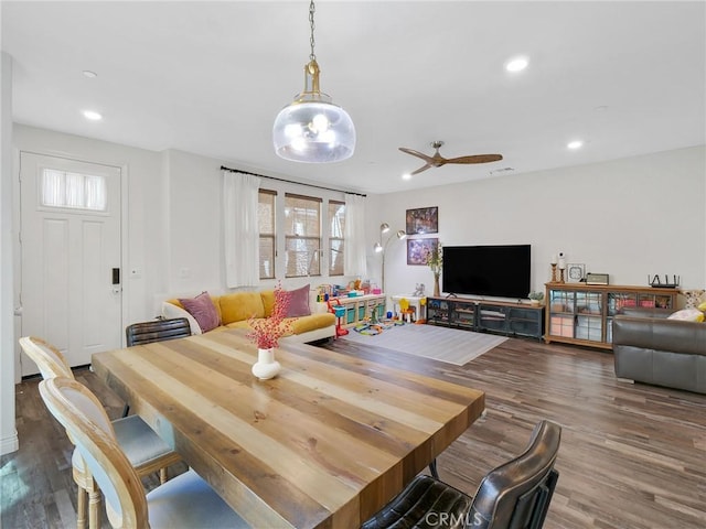 dining area with a ceiling fan, wood finished floors, and recessed lighting