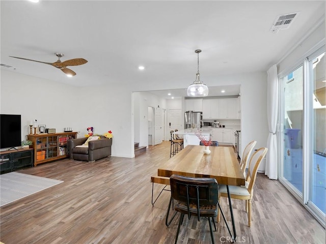 dining area featuring light wood-style flooring, visible vents, and recessed lighting