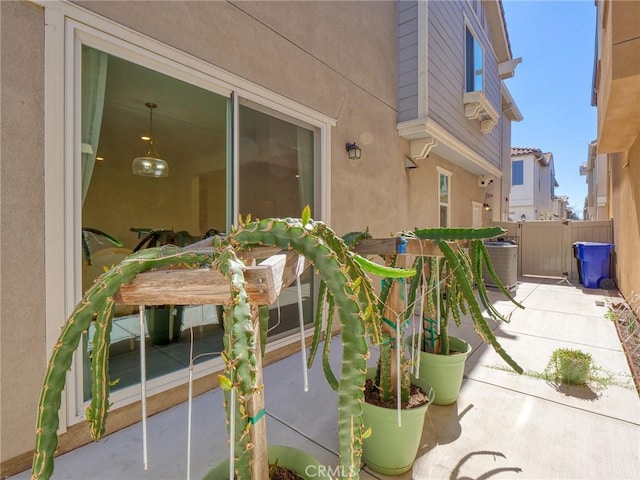 view of patio featuring a gate and fence