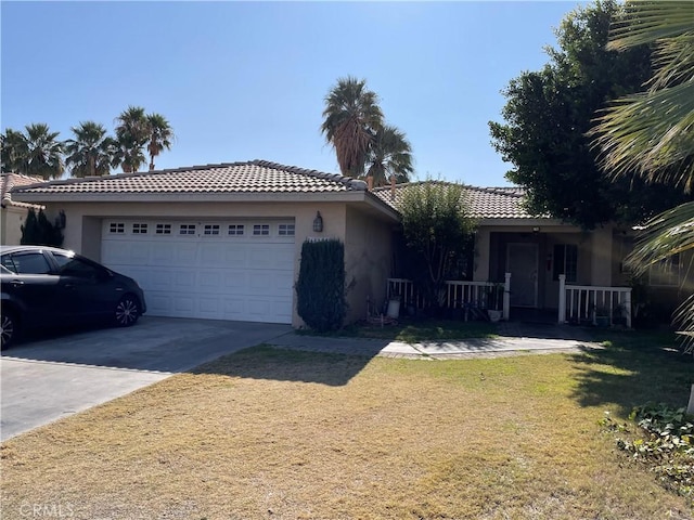 single story home with a front lawn, stucco siding, a porch, concrete driveway, and a garage