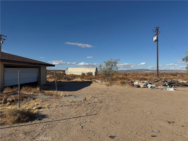 view of yard featuring a garage