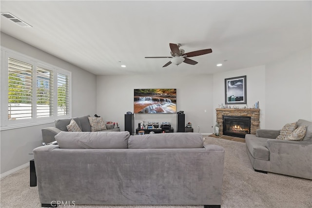 living room featuring baseboards, recessed lighting, visible vents, and light colored carpet