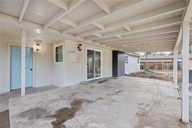 view of patio featuring fence