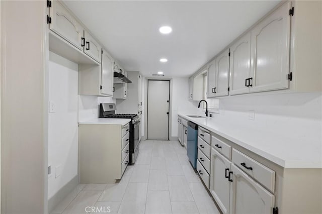 kitchen featuring appliances with stainless steel finishes, under cabinet range hood, a sink, and light countertops