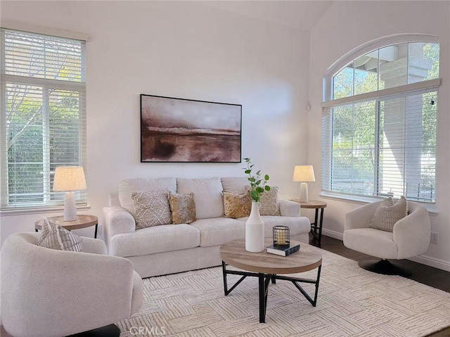 living area with a healthy amount of sunlight and baseboards