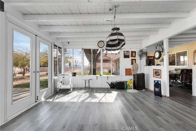 unfurnished sunroom featuring wood ceiling and beam ceiling