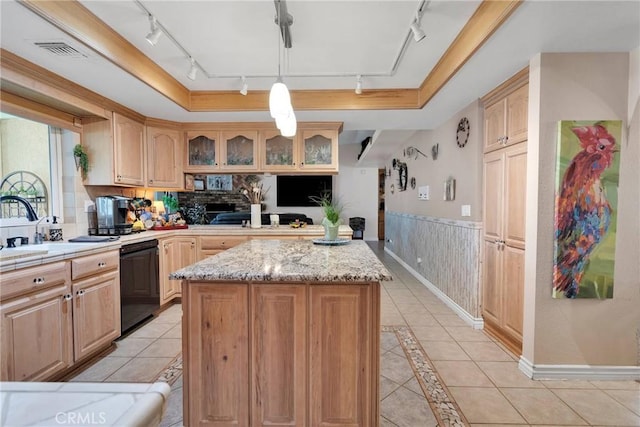 kitchen with glass insert cabinets, dishwasher, a raised ceiling, a kitchen island, and visible vents