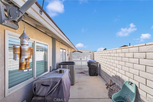 view of patio / terrace featuring a fenced backyard and central air condition unit