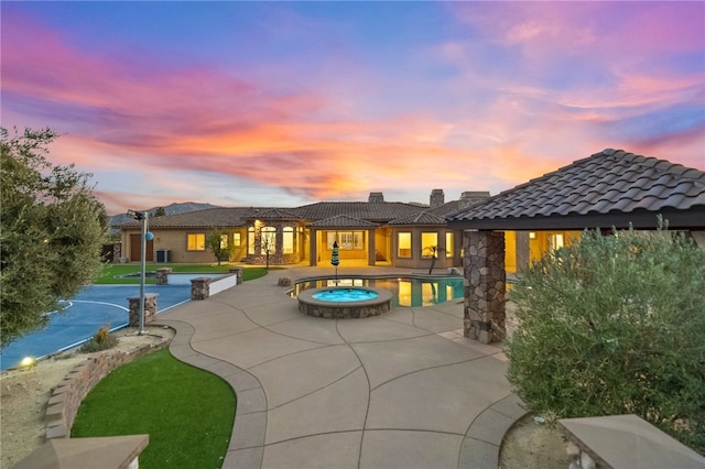 43840 E Vallejo Ave, Temecula, CA 92592 - pool at dusk with an in-ground hot tub, a patio area, and an outdoor pool