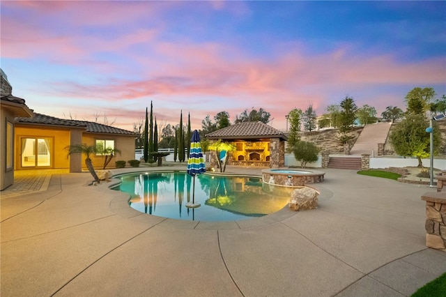 43840 E Vallejo Ave, Temecula, CA 92592 - pool at dusk with a gazebo, a patio, and a pool with connected hot tub