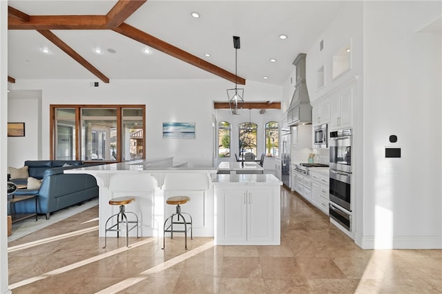 43840 E Vallejo Ave, Temecula, CA 92592 - kitchen featuring built in appliances, a breakfast bar area, white cabinets, recessed lighting, and light countertops