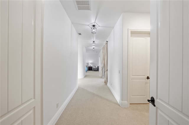 43840 E Vallejo Ave, Temecula, CA 92592 - hallway featuring light carpet and baseboards