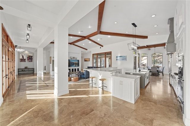 43840 E Vallejo Ave, Temecula, CA 92592 - kitchen featuring a spacious island, a chandelier, recessed lighting, open floor plan, and a breakfast bar