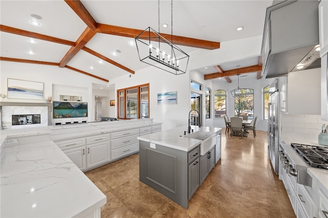 43840 E Vallejo Ave, Temecula, CA 92592 - kitchen featuring gray cabinets, a sink, appliances with stainless steel finishes, tasteful backsplash, and a kitchen island with sink