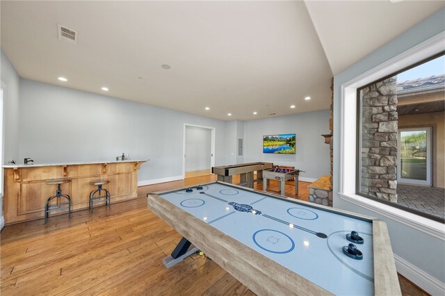 43840 E Vallejo Ave, Temecula, CA 92592 - playroom featuring light wood-type flooring, recessed lighting, and bar area