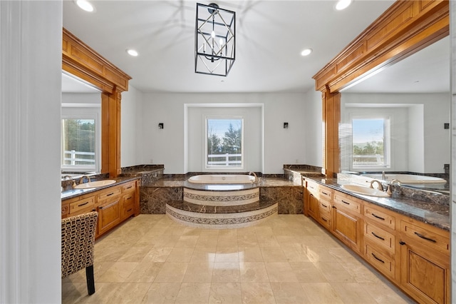 43840 E Vallejo Ave, Temecula, CA 92592 - full bathroom with healthy amount of natural light, a garden tub, recessed lighting, and vanity
