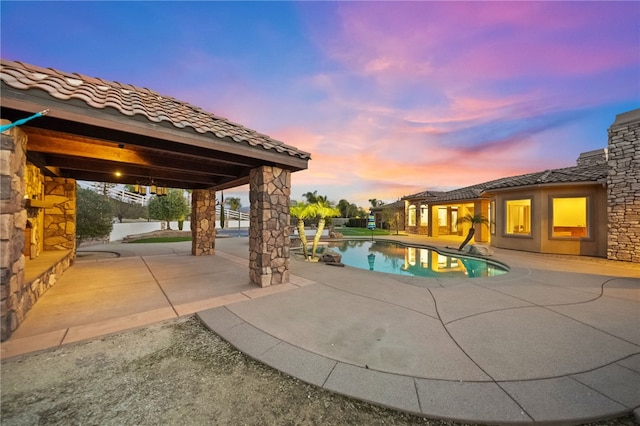 43840 E Vallejo Ave, Temecula, CA 92592 - pool at dusk with a patio area