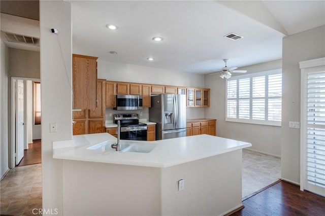 773 Camino De Plata, San Jacinto, CA 92583 - kitchen featuring visible vents, appliances with stainless steel finishes, a peninsula, and light countertops