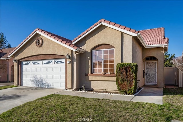 view of front of property featuring stucco siding, an attached garage, fence, driveway, and a tile roof