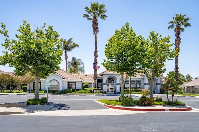 773 Camino De Plata, San Jacinto, CA 92583 - view of front of house featuring stucco siding, a tile roof, and uncovered parking