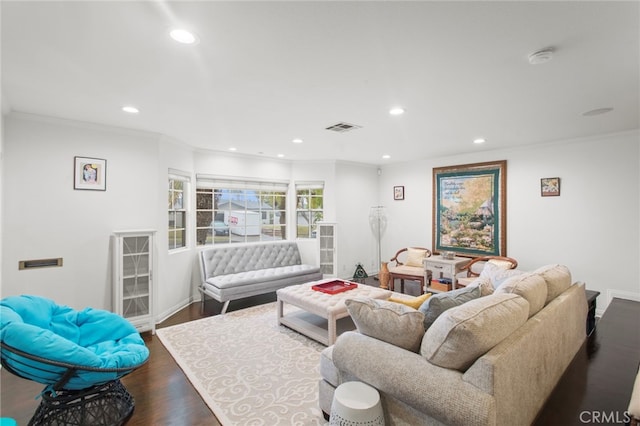 living room featuring crown molding, visible vents, wood finished floors, and recessed lighting