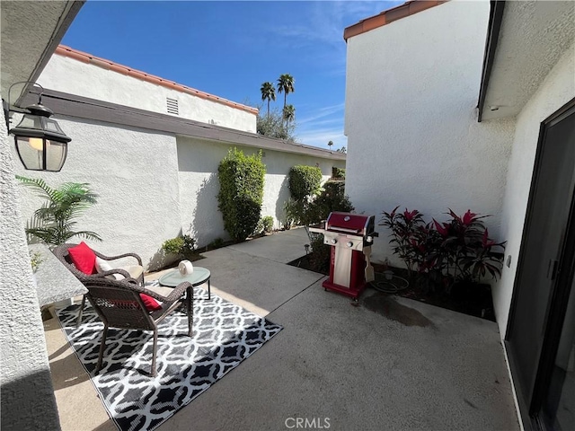 view of patio with a grill