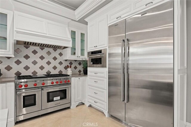 627 W Palm Dr, Arcadia, CA 91007 - kitchen featuring high end appliances, white cabinets, ornamental molding, premium range hood, and glass insert cabinets