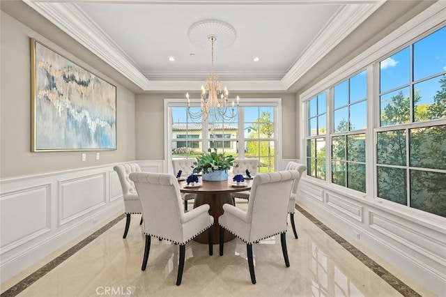 627 W Palm Dr, Arcadia, CA 91007 - dining area featuring inlaid floor details, a decorative wall, a chandelier, a raised ceiling, and crown molding