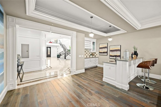 627 W Palm Dr, Arcadia, CA 91007 - bar area with a tray ceiling, ornamental molding, dark wood-style floors, a sink, and stairway