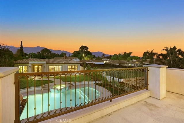 627 W Palm Dr, Arcadia, CA 91007 - balcony at dusk featuring view of pool area and a mountain view
