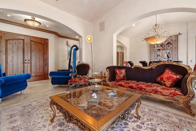 living area featuring arched walkways, visible vents, marble finish floor, and lofted ceiling