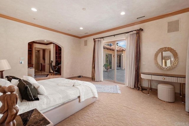 bedroom featuring access to exterior, visible vents, arched walkways, and baseboards