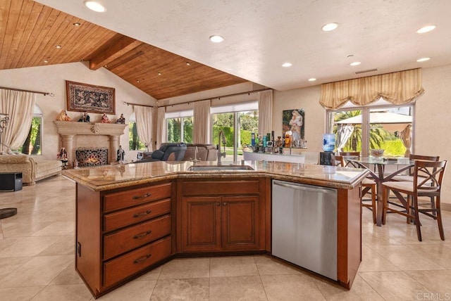 kitchen with a sink, open floor plan, dishwasher, and a kitchen island with sink