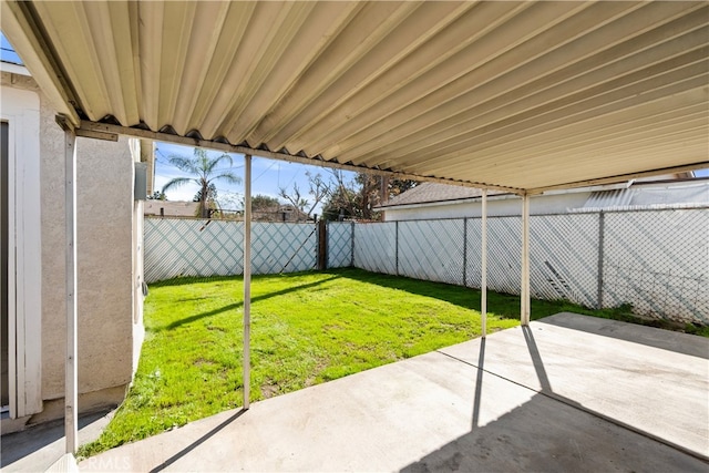 view of yard featuring a patio area and a fenced backyard