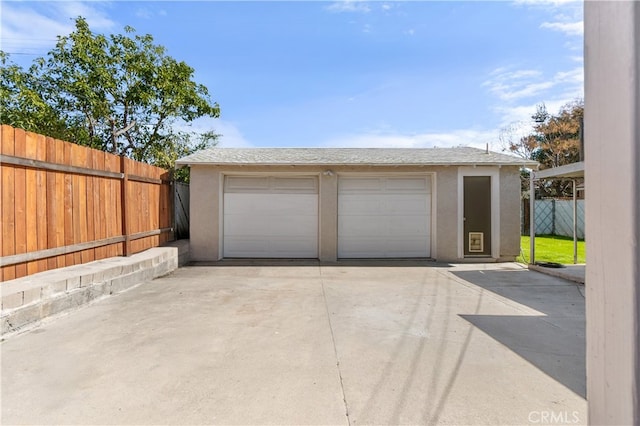 detached garage with fence