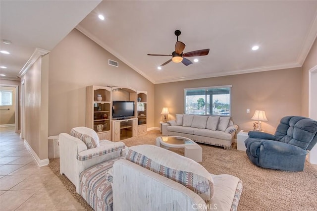 living area featuring vaulted ceiling, ornamental molding, light tile patterned floors, and visible vents