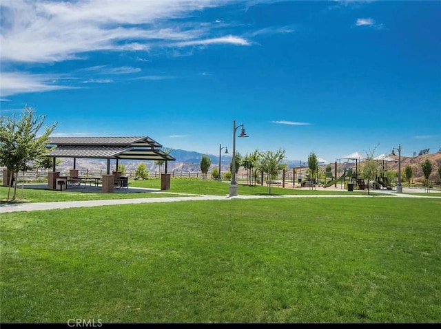 view of home's community featuring a gazebo, a yard, and a mountain view