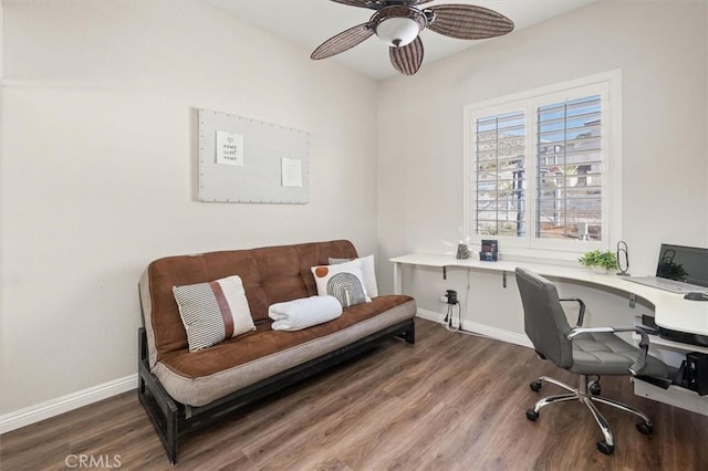 office area with dark wood-style floors, baseboards, and a ceiling fan