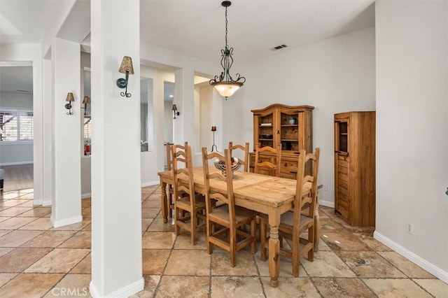 dining space featuring visible vents and baseboards