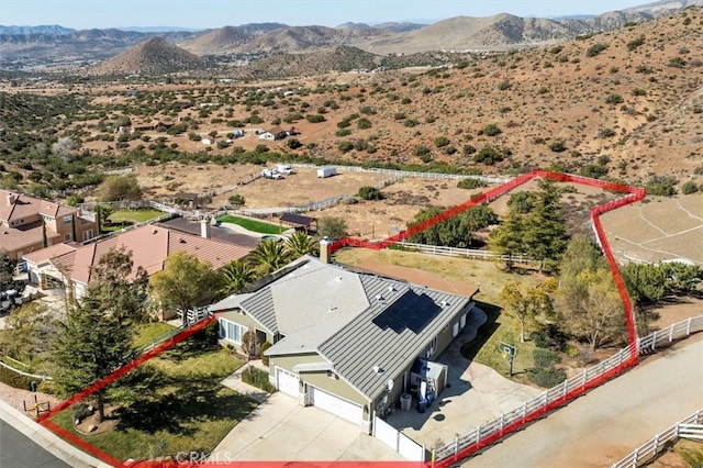 birds eye view of property with a mountain view