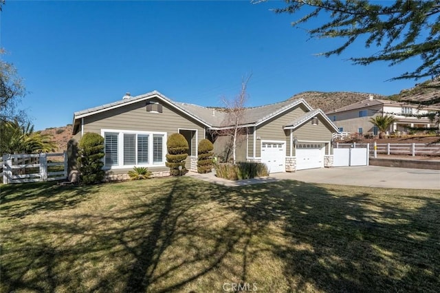 single story home with a garage, driveway, fence, and a front yard