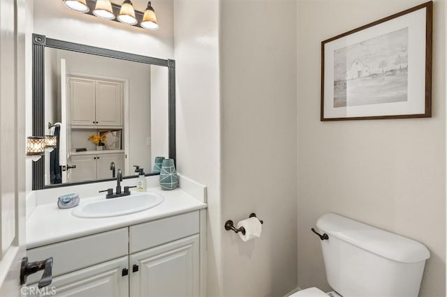 bathroom with toilet and vanity