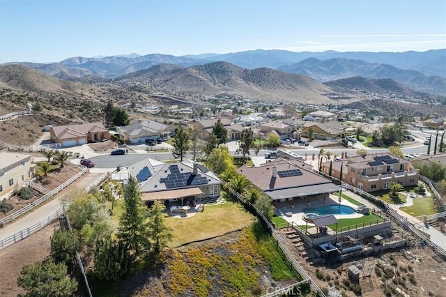 drone / aerial view featuring a residential view and a mountain view