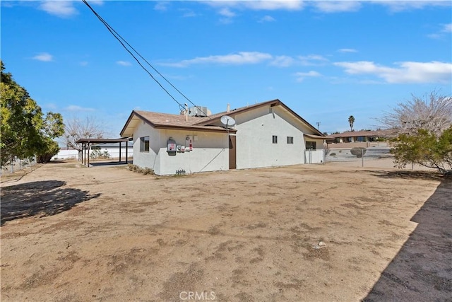 back of property with stucco siding